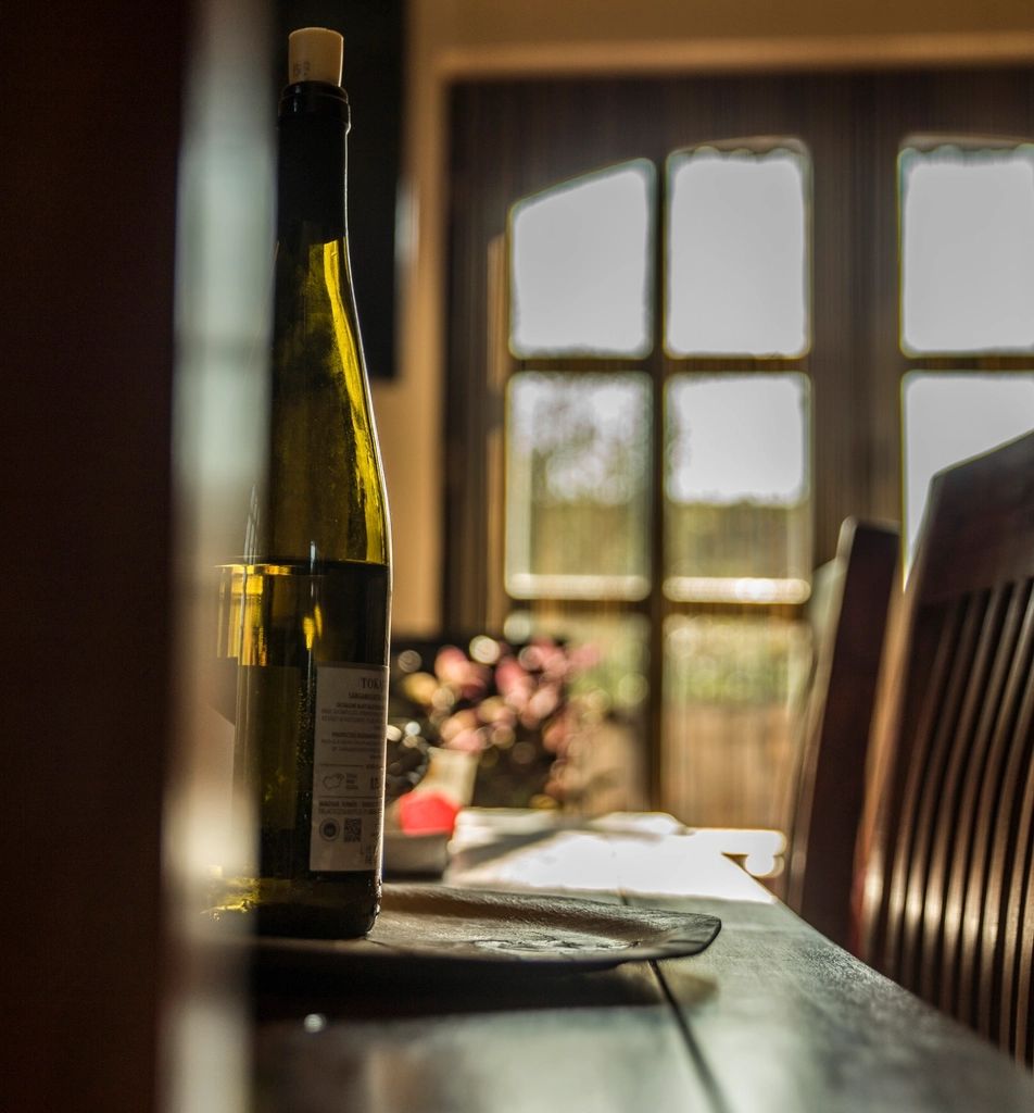 Wine glasses and bottles on the counter