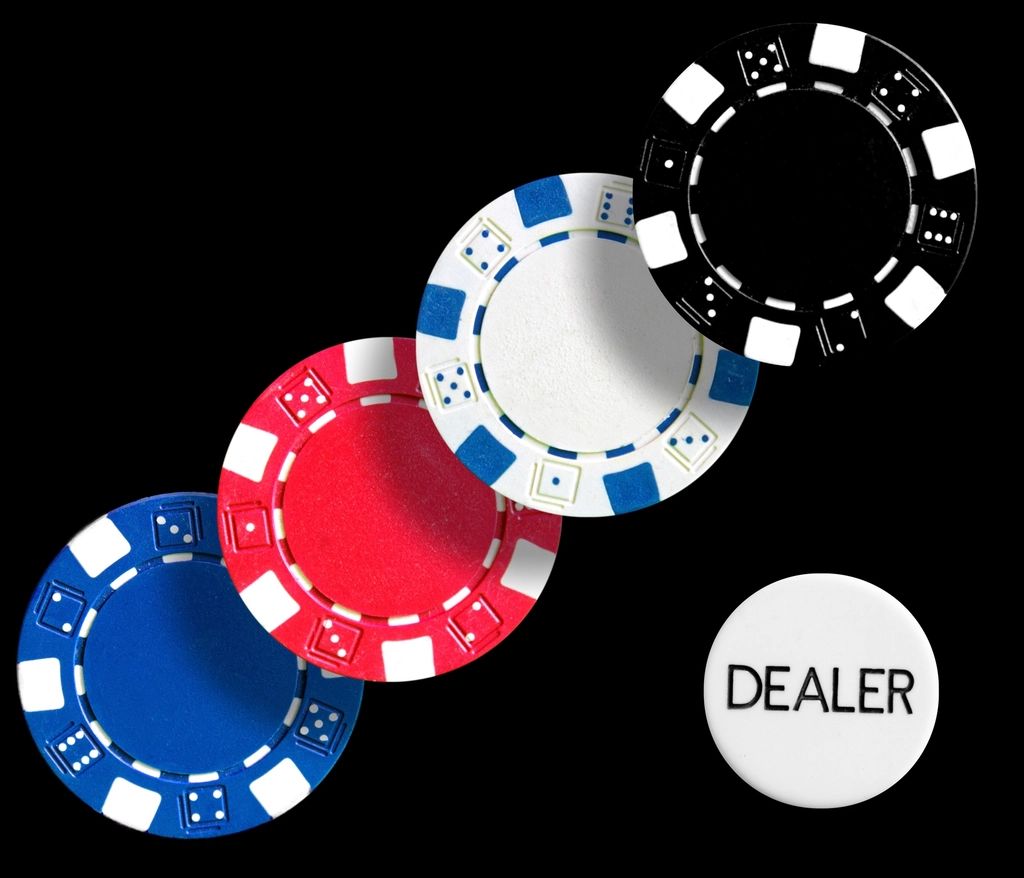 Gaming chips and cards on the table felt